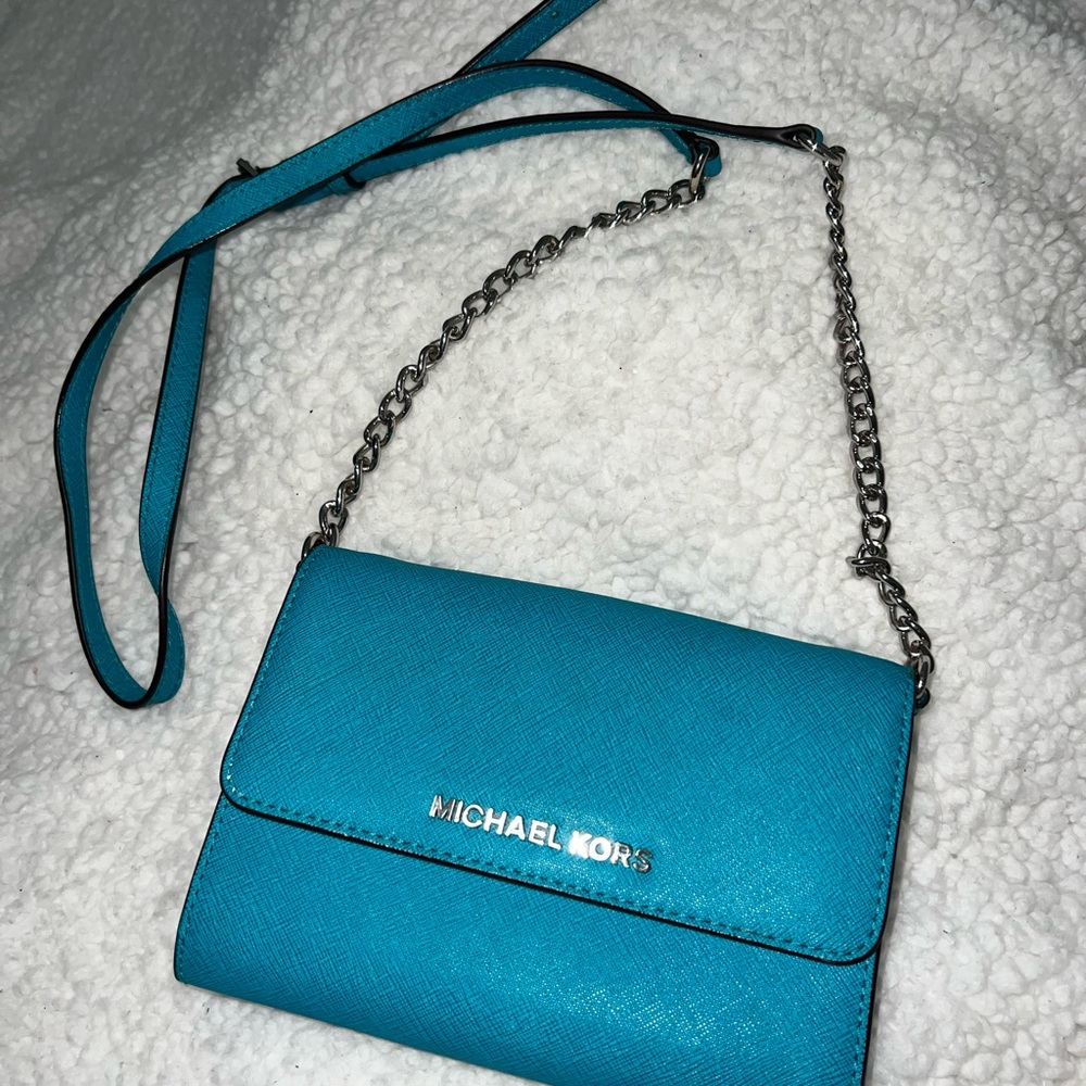 Michael Kors turquoise crossbody bag.